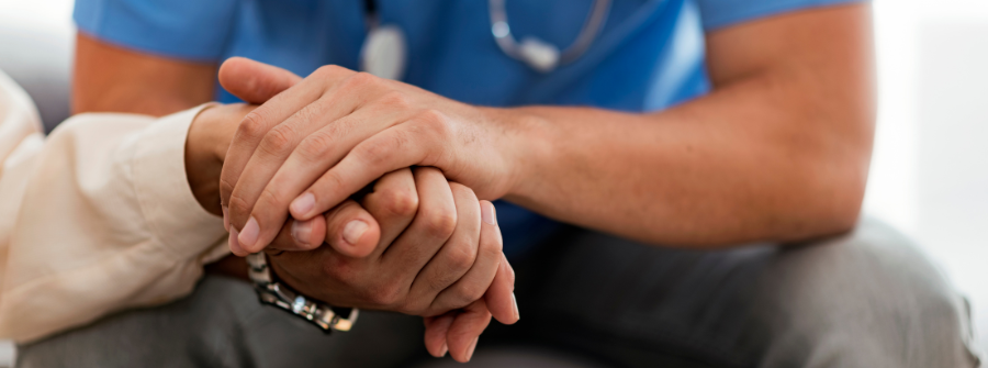 1 of 4, doctor holding patient hand